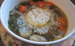 Lemony Kale Basil Mushroom Soup with a Lemon Slice and Parmesan!